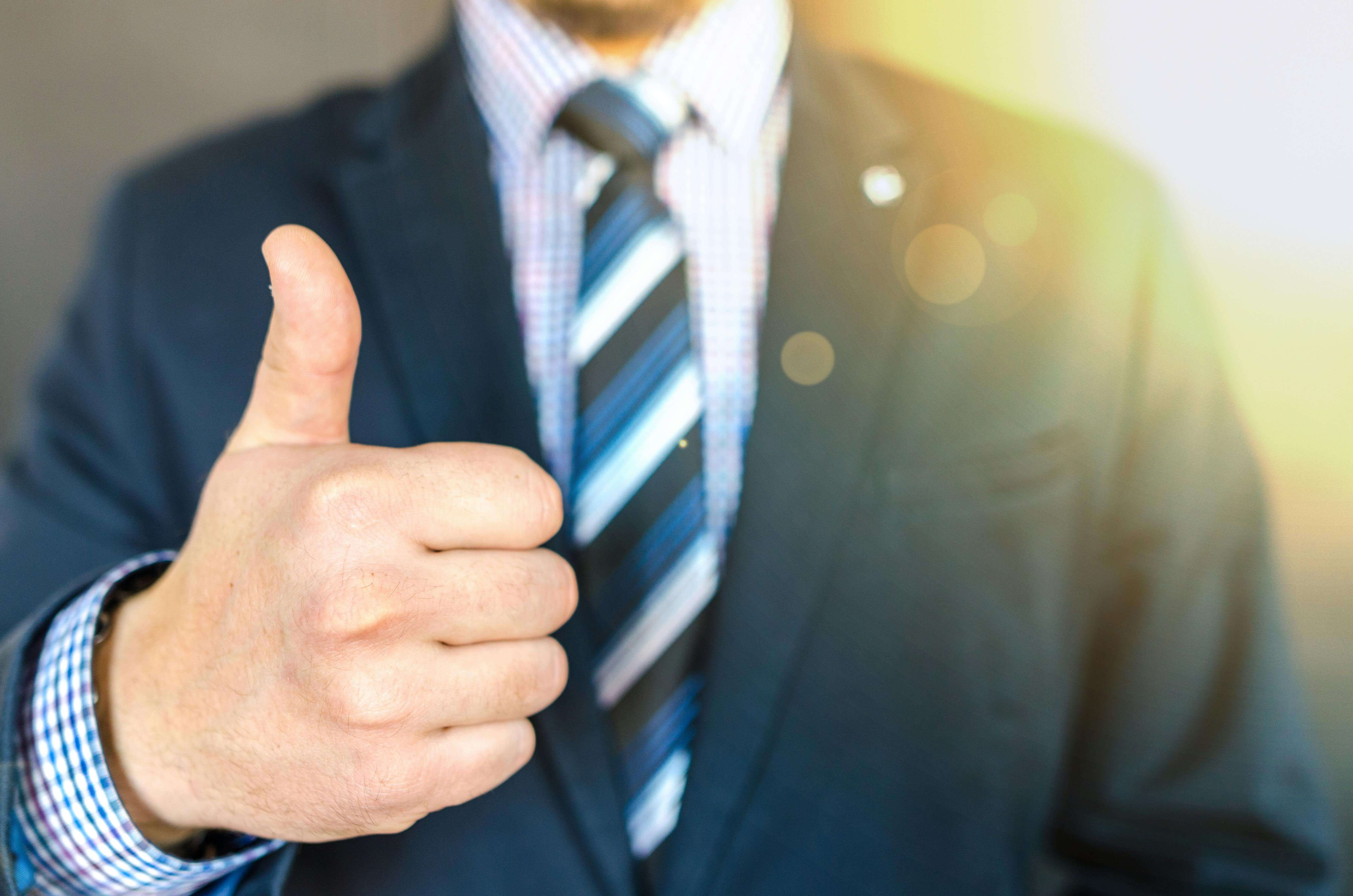 Close-up Photo of Man with Thumbs Up Gesture