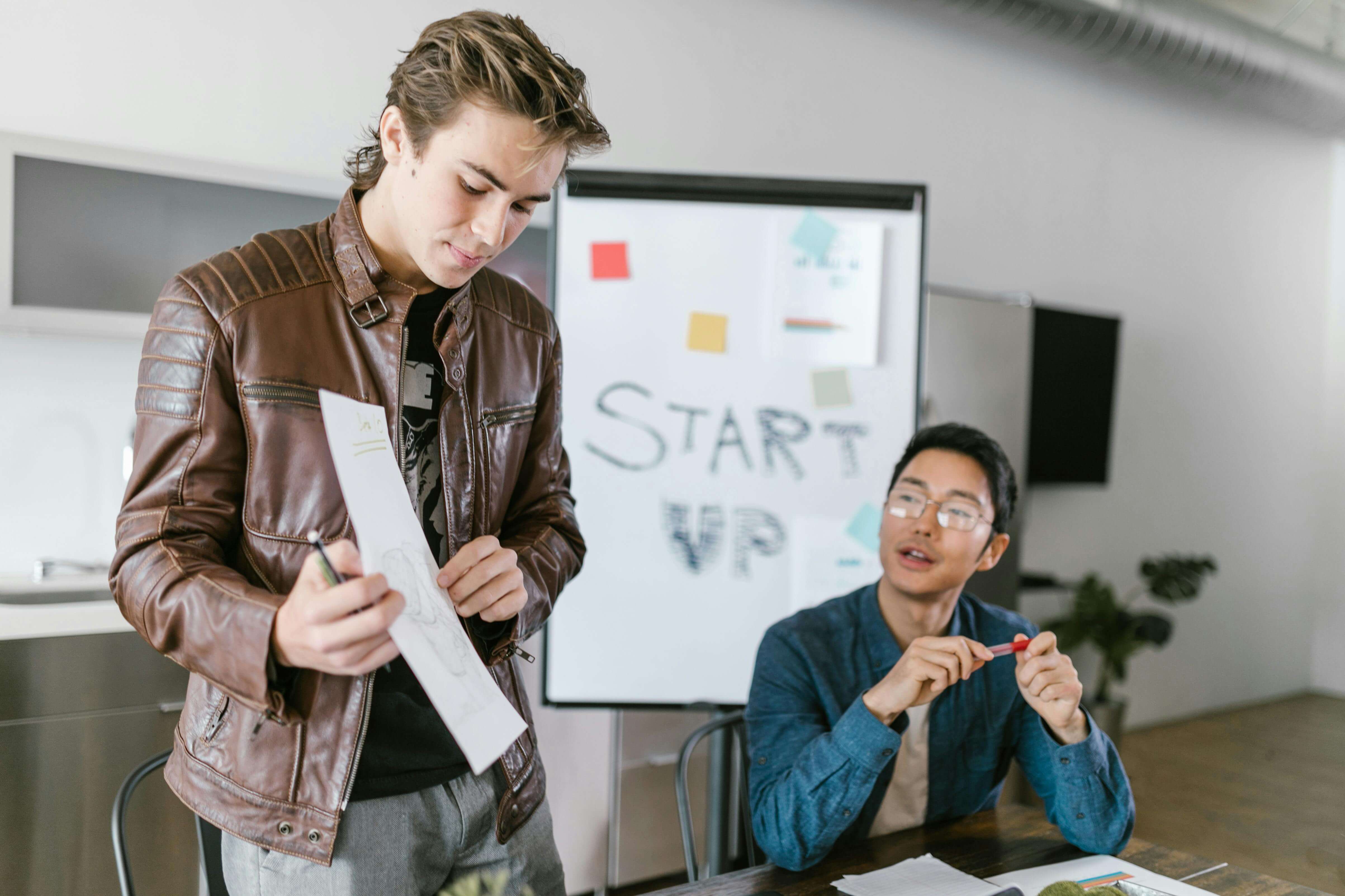 Photo of Man Presenting Ideas