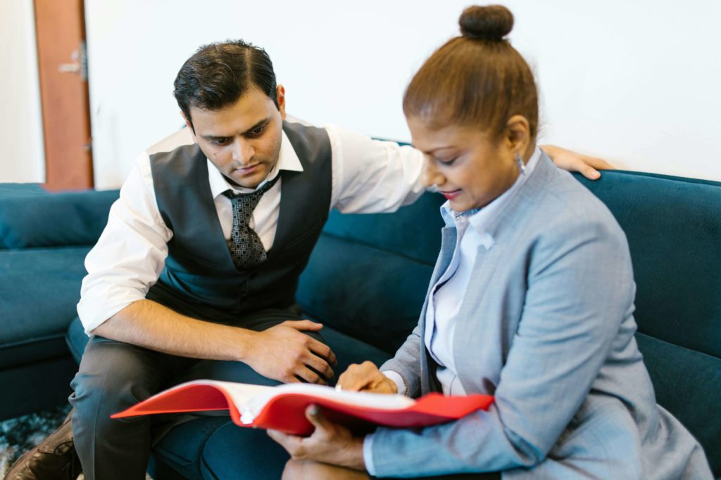 Woman Showing the Documents to His Officemate