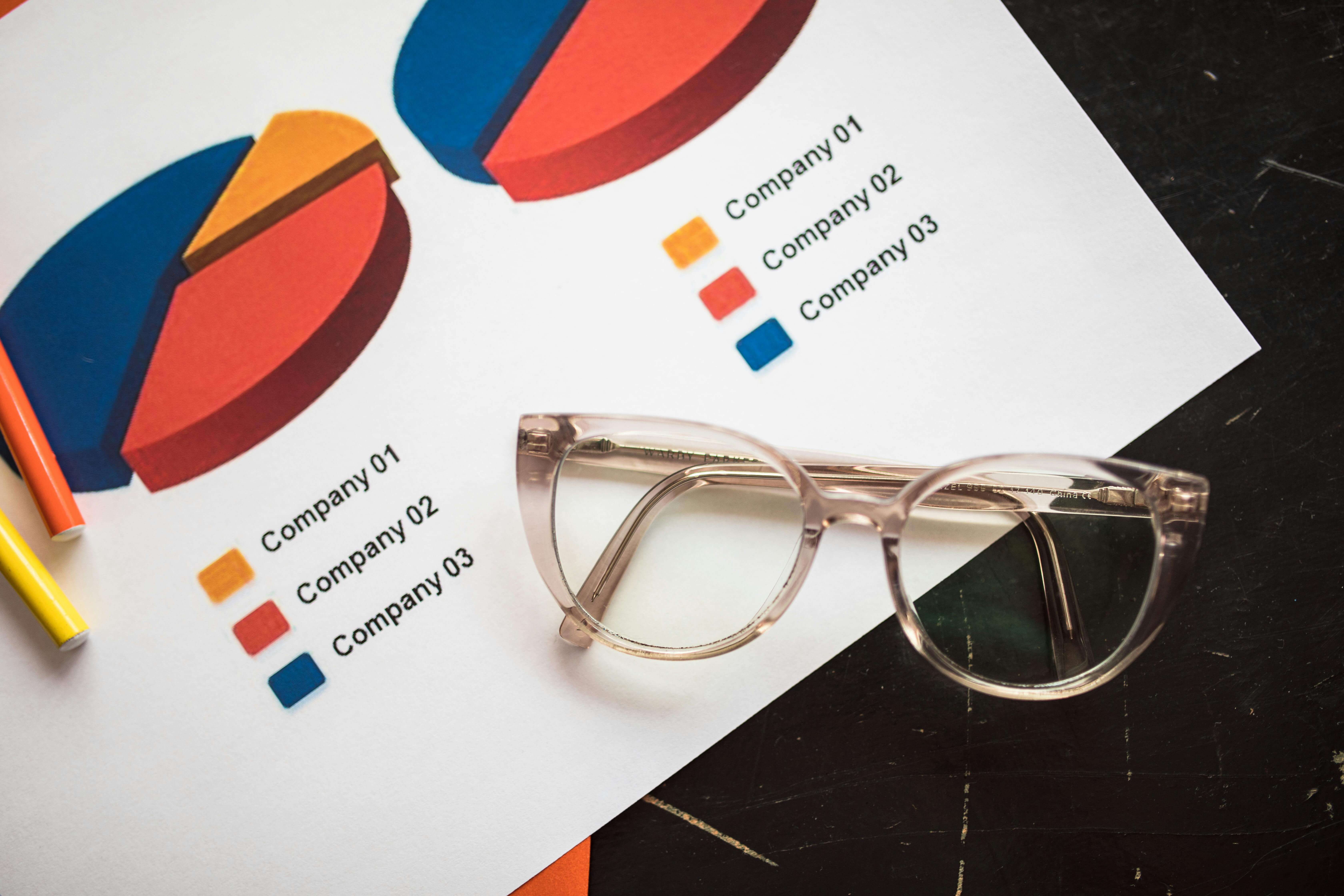 Silver Framed Eyeglasses on White Paper