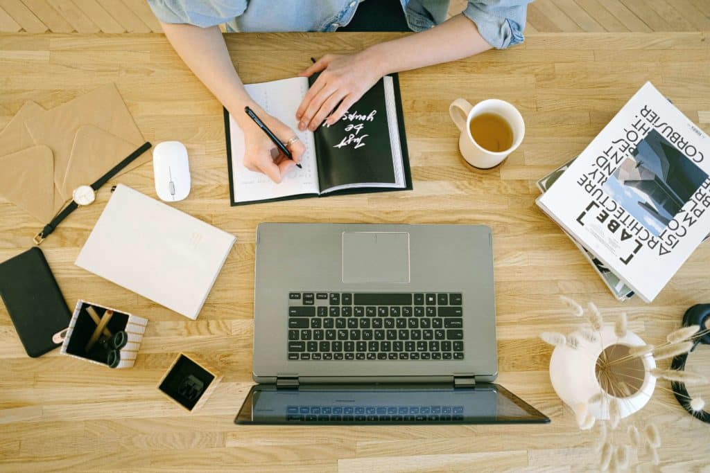 Woman Writing in Notebook