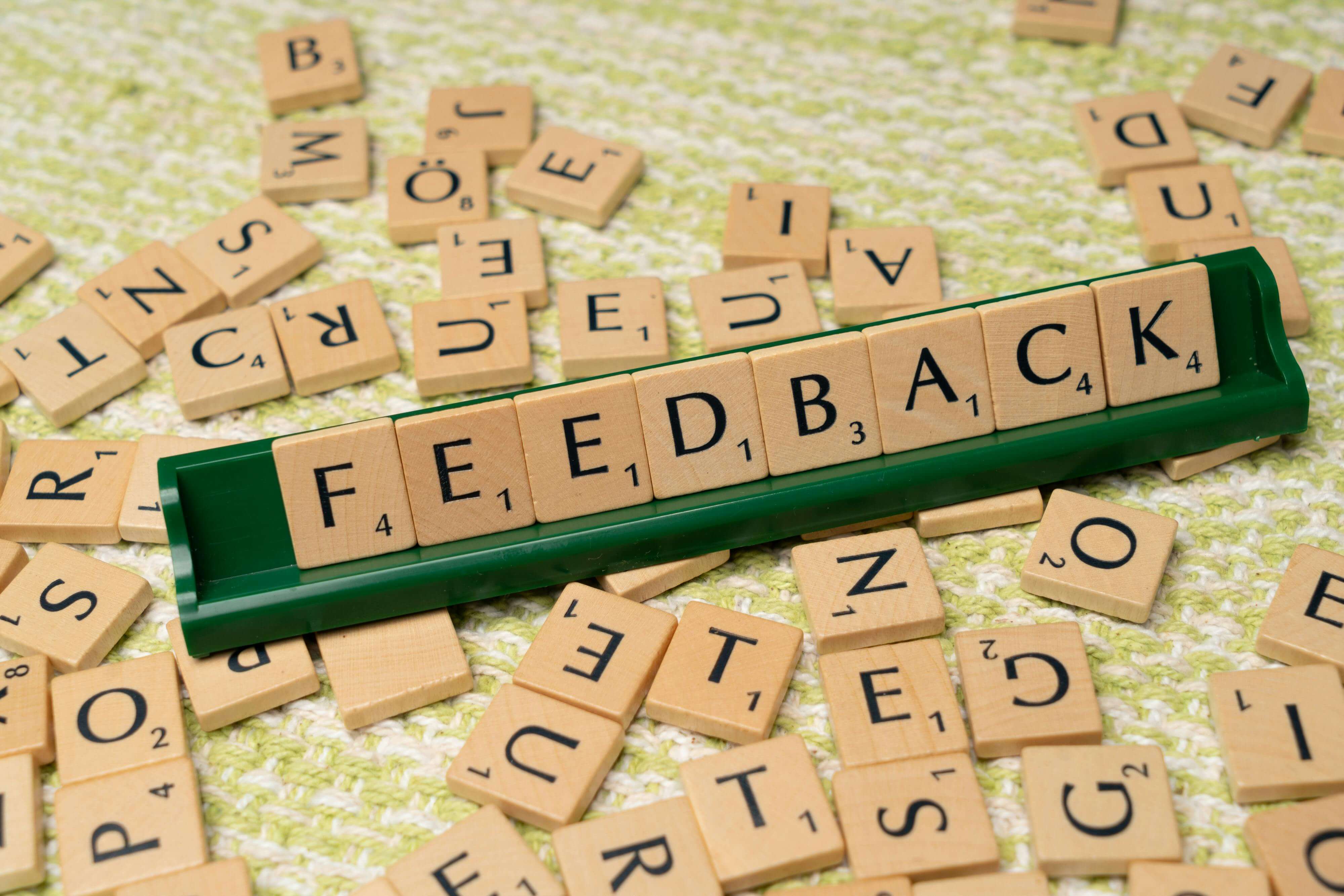 feedback is spelled out with scrabble tiles