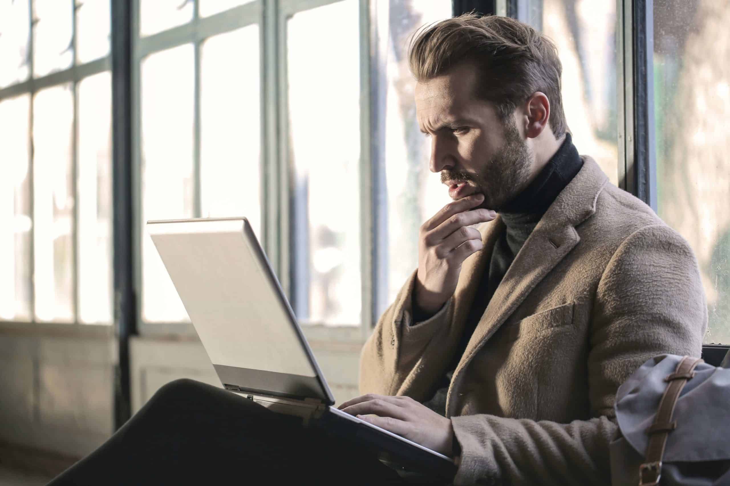 Man Wearing Brown Jacket