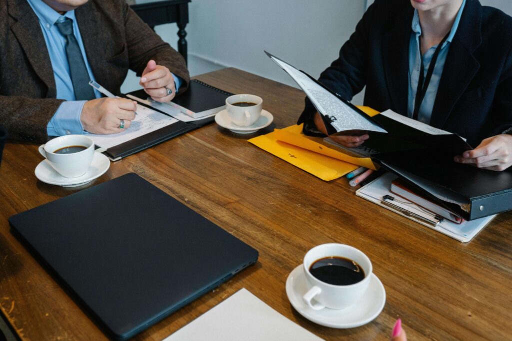 colleagues discussing business project in workspace